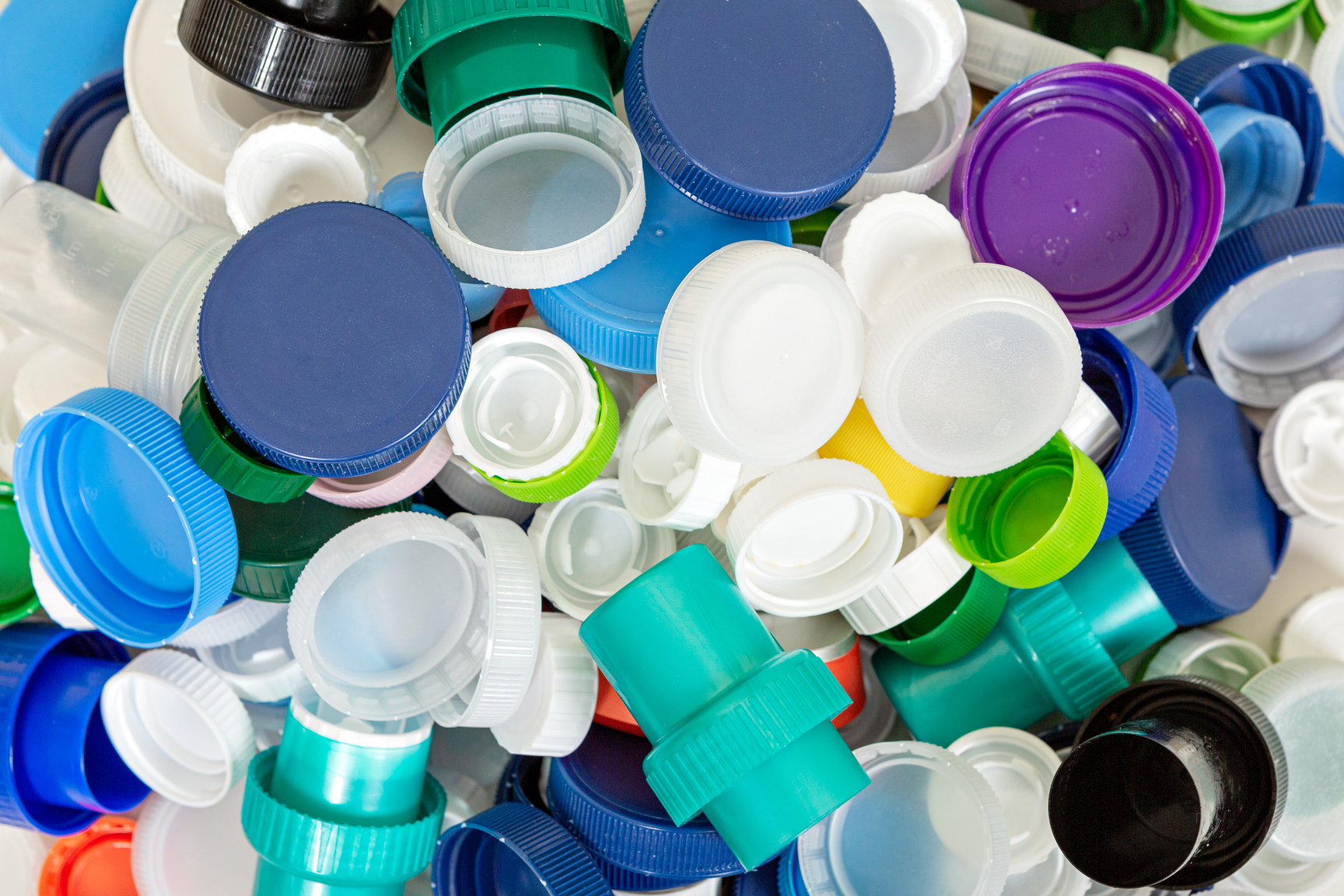 Pile of various plastic lids